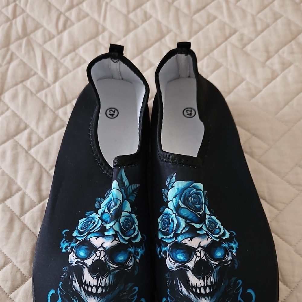 Black Slip-On Shoes with Blue Skull Design